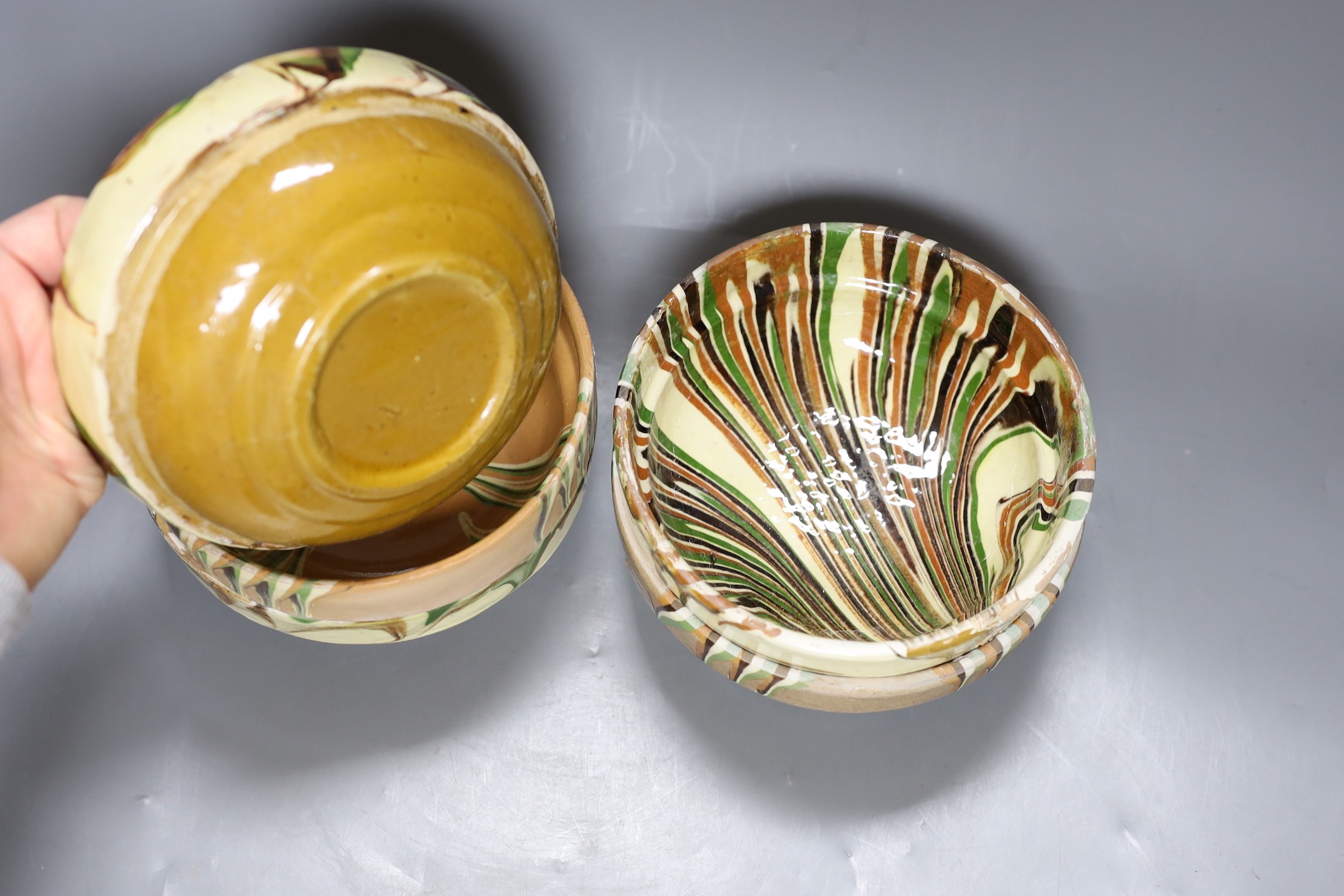 Six French slipware bowls, 16.5cm diameter